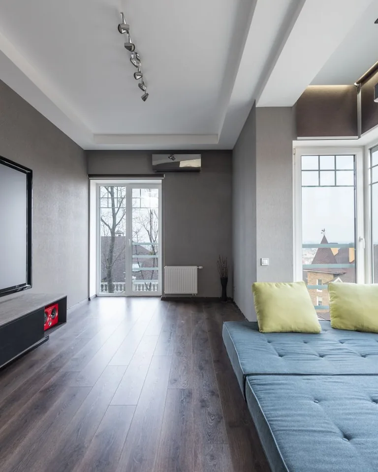 Basement home theater with projector screen and recliner seating