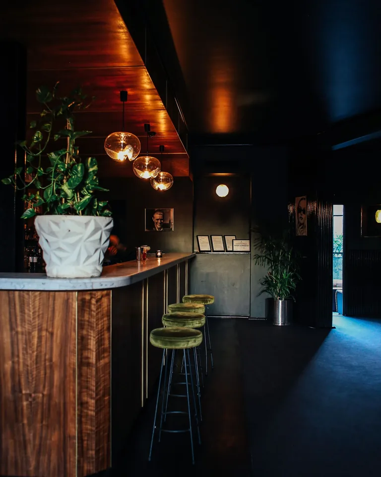 Stylish basement bar and lounge with warm lighting