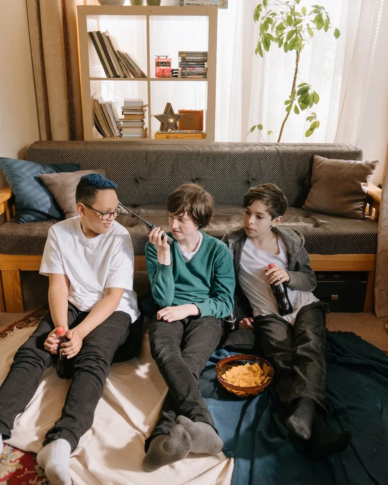 Casual hangout room with deep sectional sofa and game setup