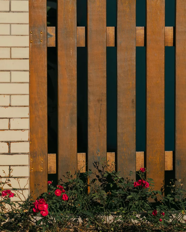 Rustic wooden pallet fence in a garden