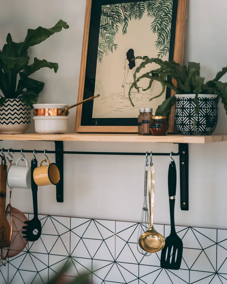 Floating shelves displaying mugs in a kitchen
