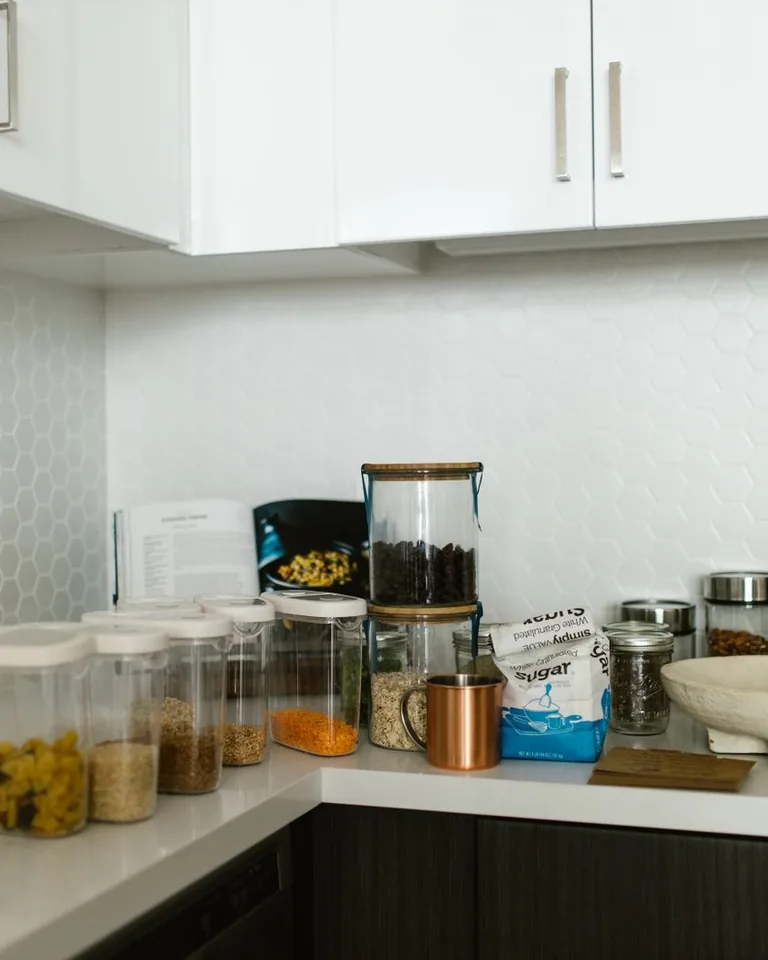Glass canisters arranged on a kitchen counter