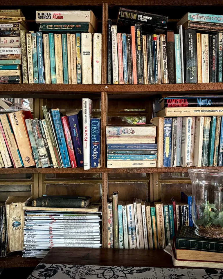 Cozy bookshelf filled with vintage books