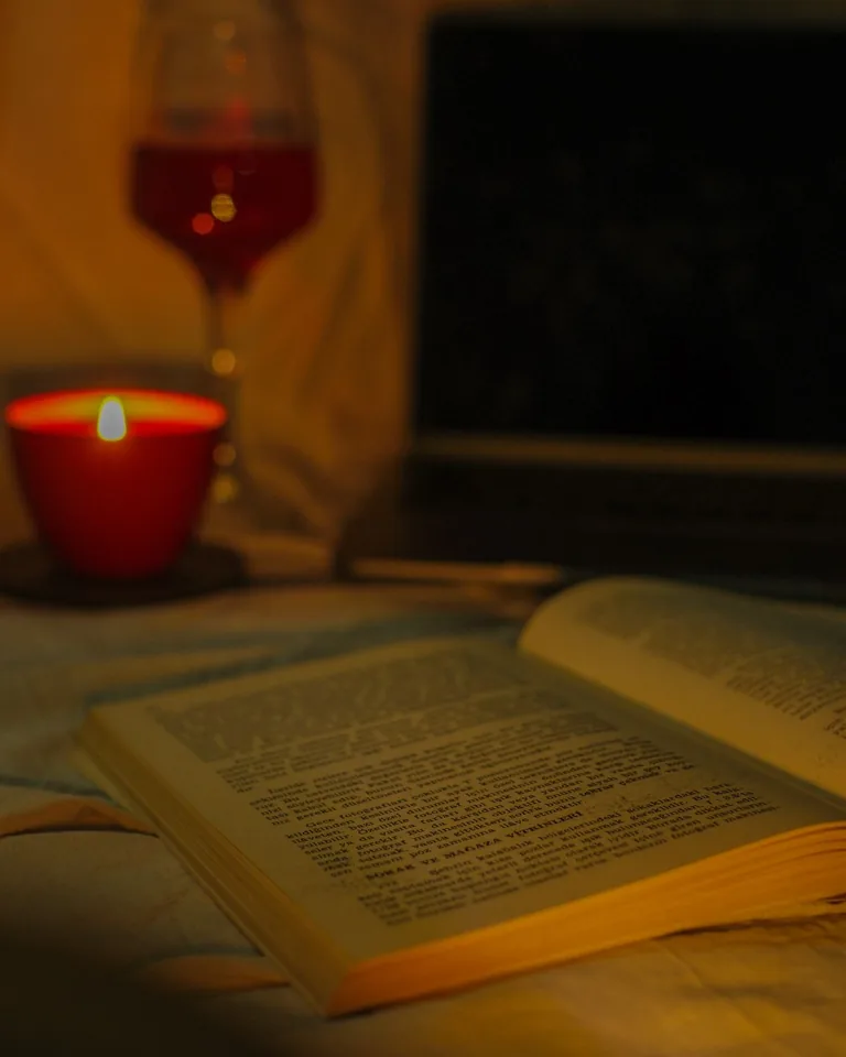 Open book in warm candlelight