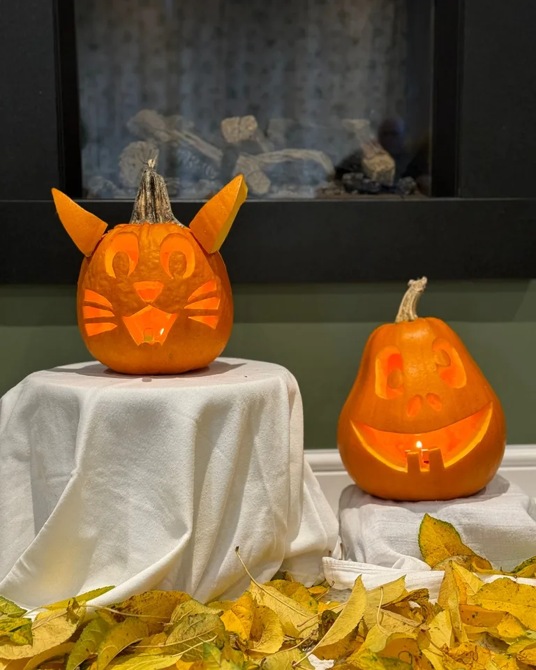 Front porch decorated with carved pumpkins for Halloween