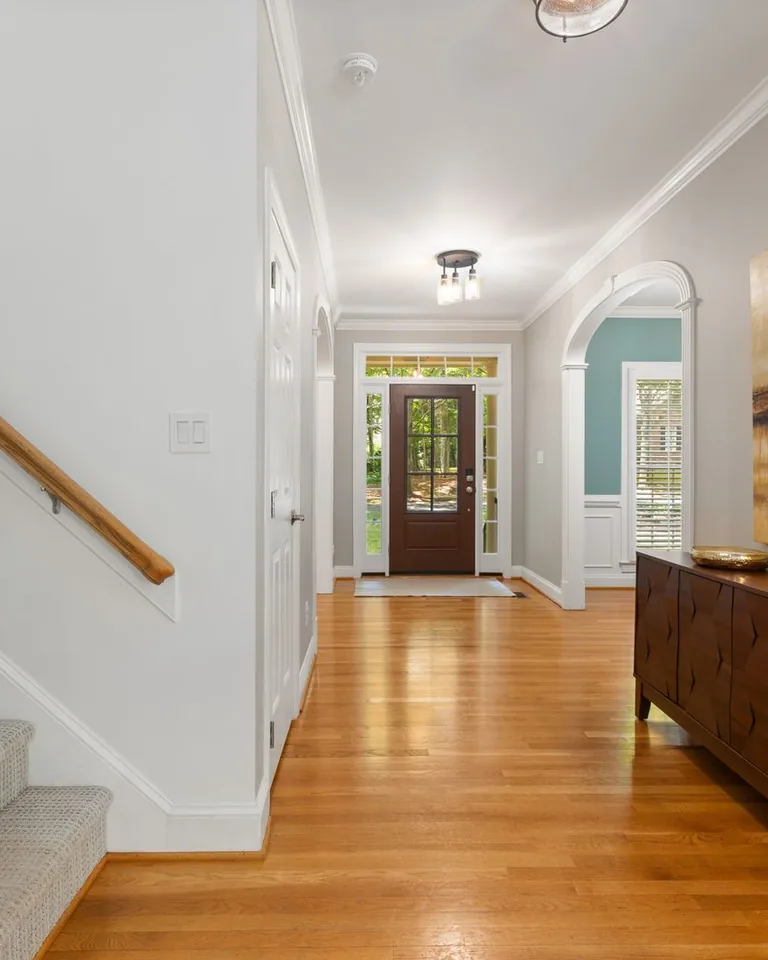 Elegant home entryway with wooden flooring