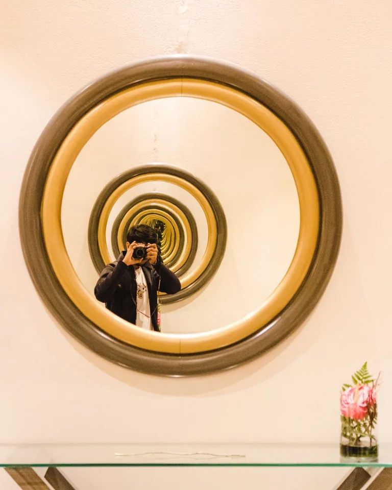 Oversized round mirror in an entryway