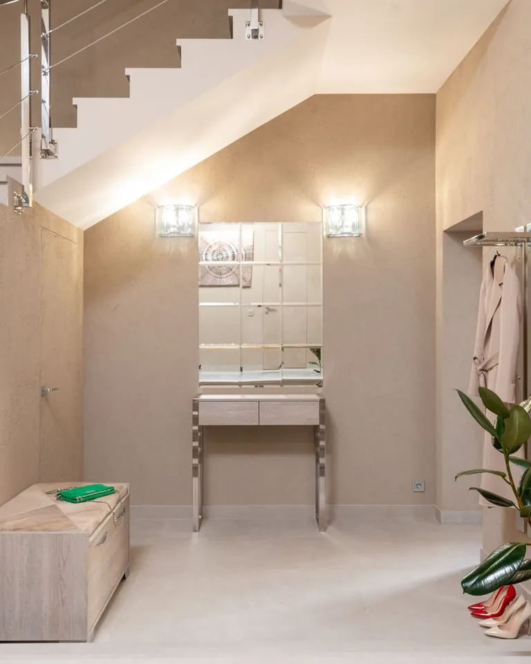 Hallway with matching lamps flanking a mirror