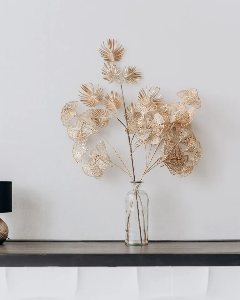 Console table with a floral arrangement and modern lamp