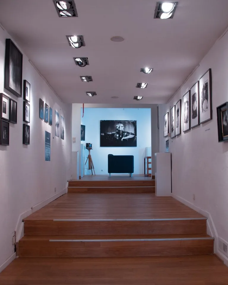 Gallery wall of framed art above an entryway