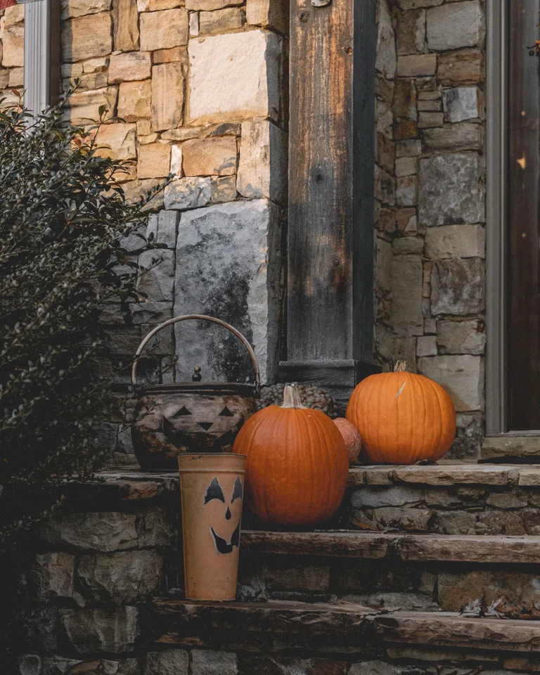 Charming rustic porch decorated with pumpkins for autumn