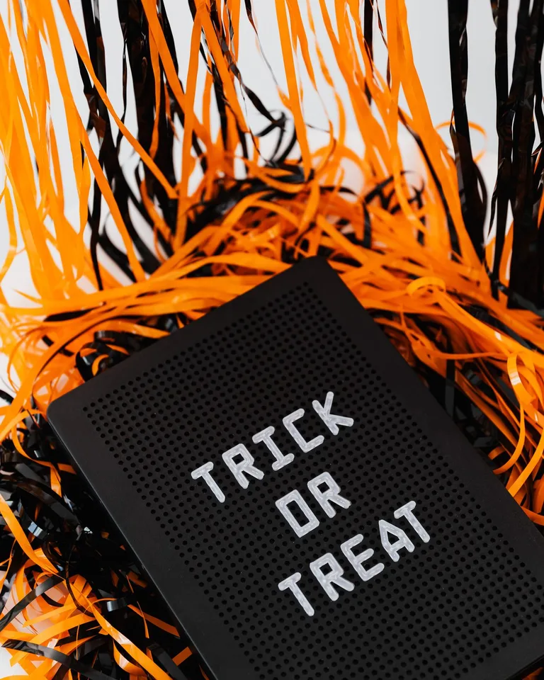 DIY Halloween entrance sign with orange and black decorations