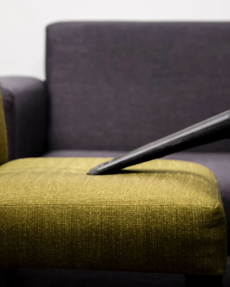 Upholstered storage ottoman in a small living room
