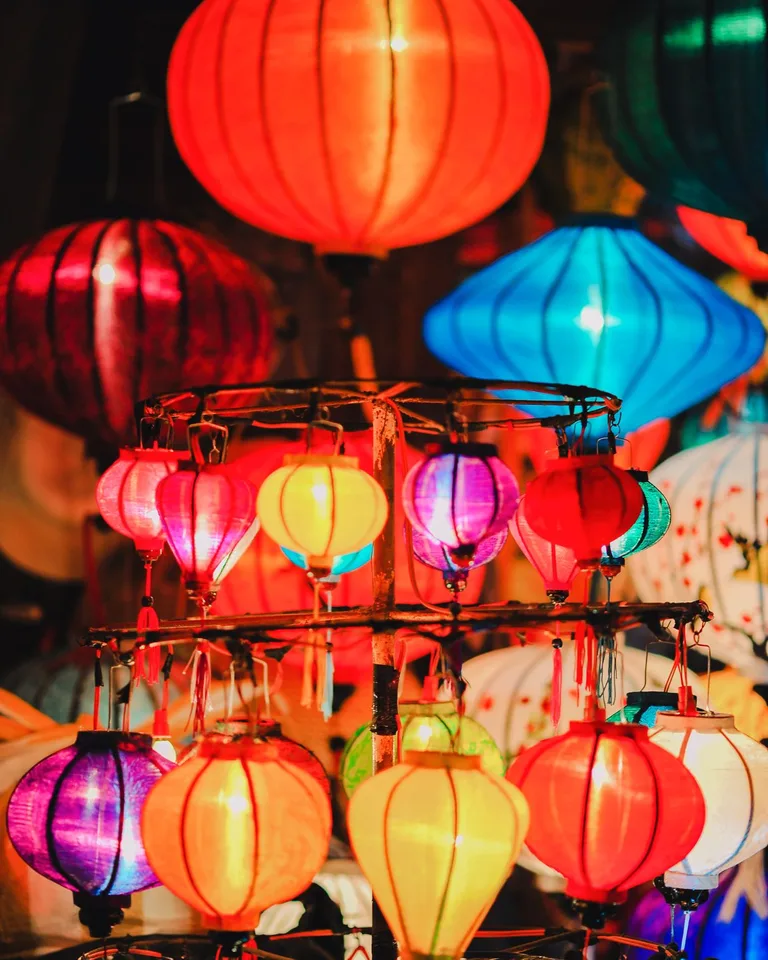 Colorful glowing paper lanterns at night