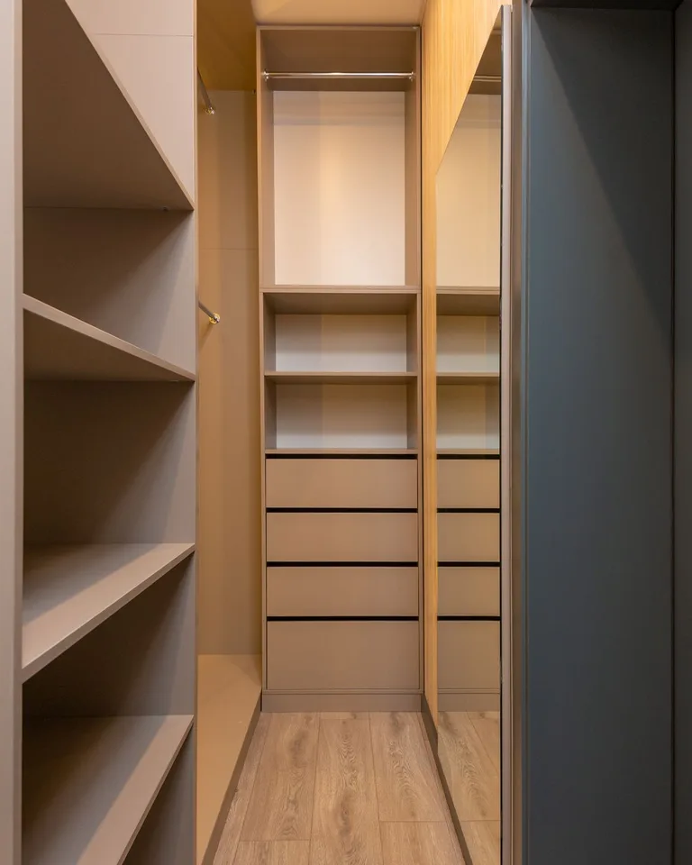 Organized closet with double hanging rods and shelves