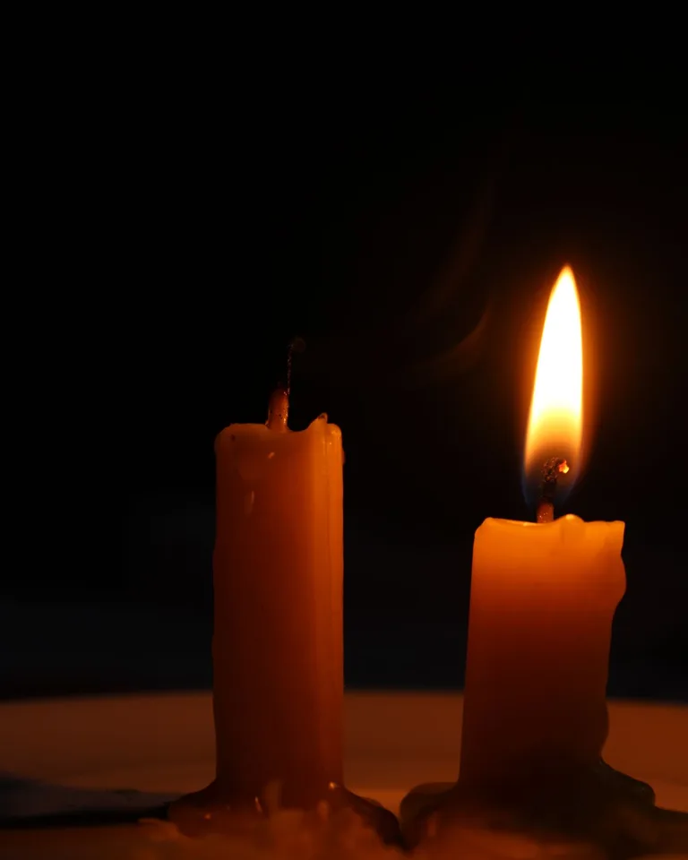 Floating candles hanging over a porch for Halloween