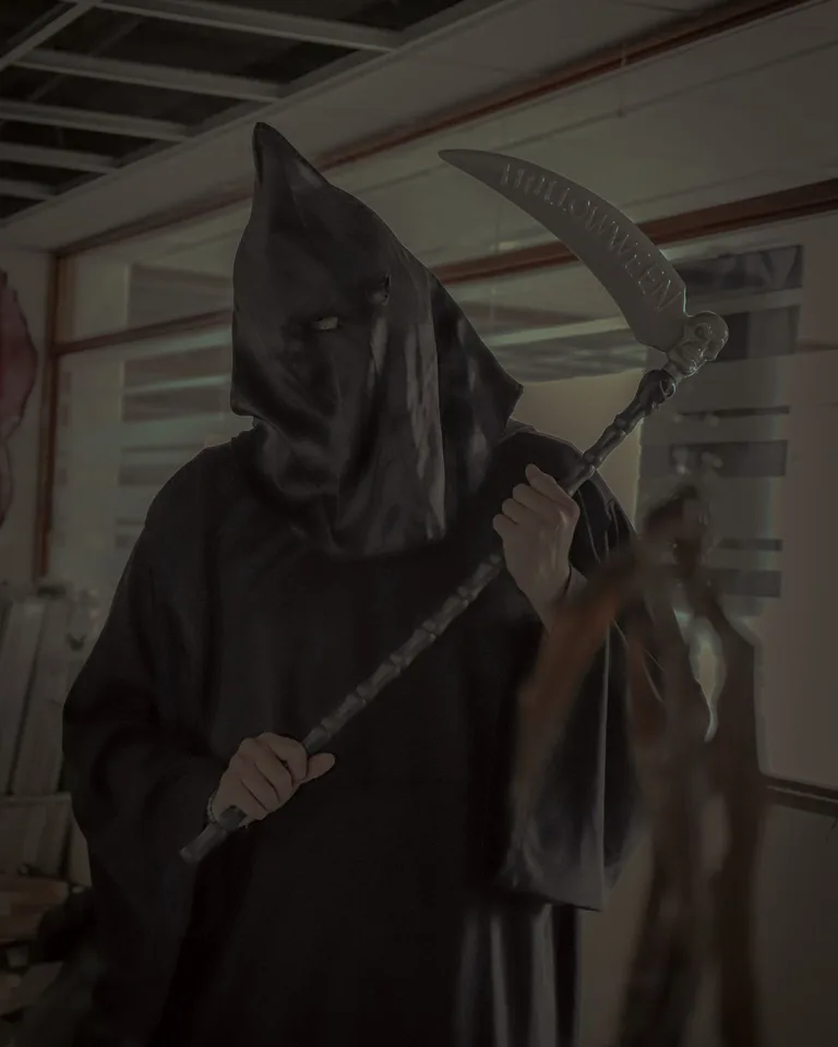 Grim reaper figure decoration for a haunted trail