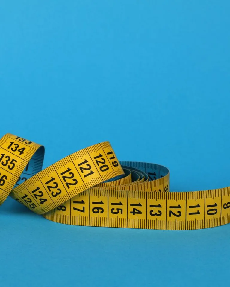 Measuring tape against a wall during home renovation planning
