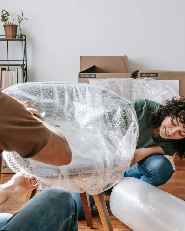 Furniture covered with protective sheets before renovation work begins