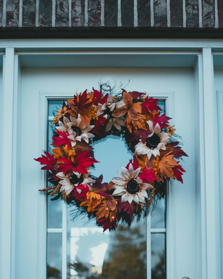 Autumn wreath hanging on front doors
