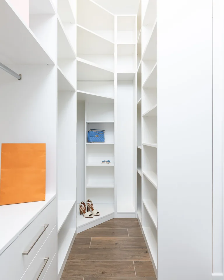 Modern white wardrobe with shelves and storage