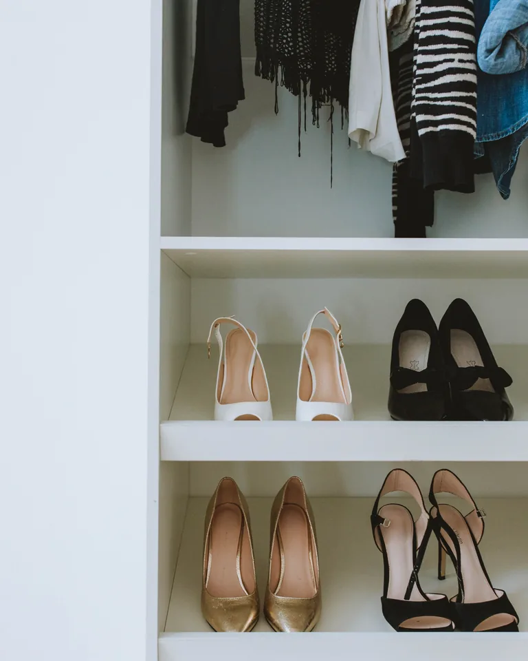 High heel shoes neatly arranged on a closet shelf