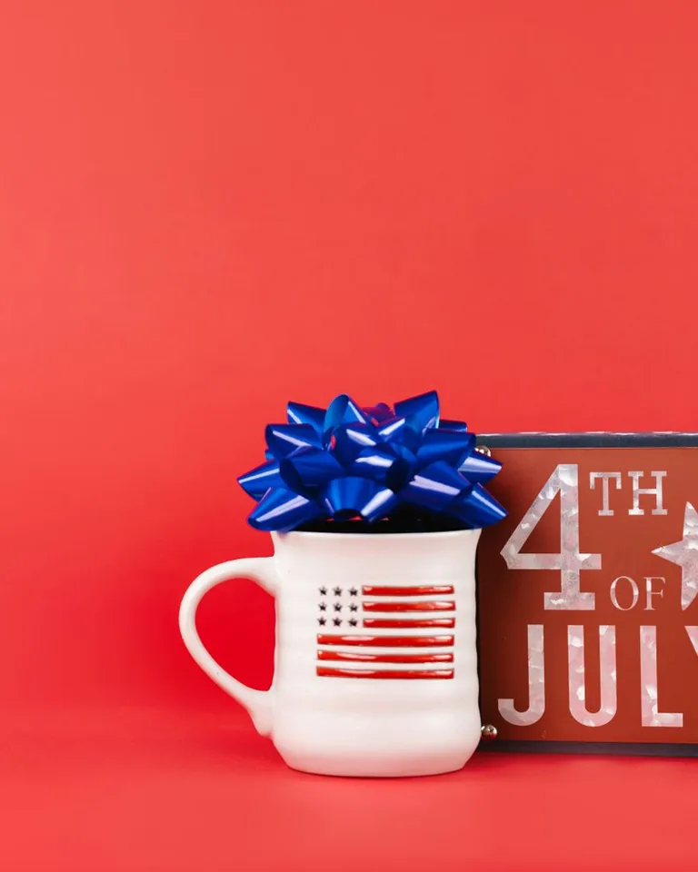 4th of July mug and sign on a red background