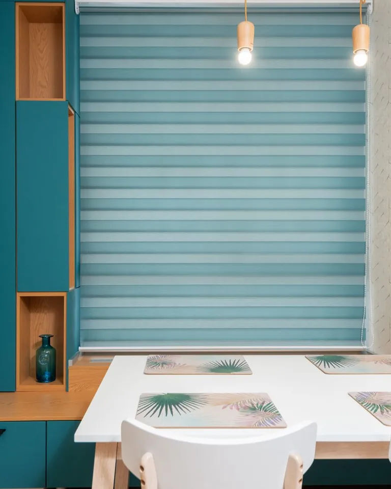 Kitchen table set with placemats under pendant lights