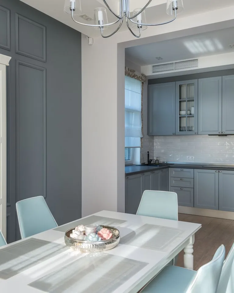 Bright breakfast corner with pastel chairs