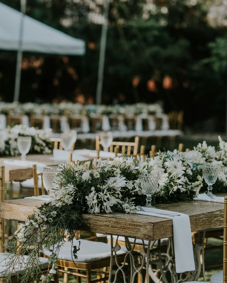 Floral arrangement of white and green flowers as a table centerpiece