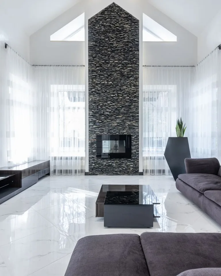 Bright small living room with sofa and clever storage furniture